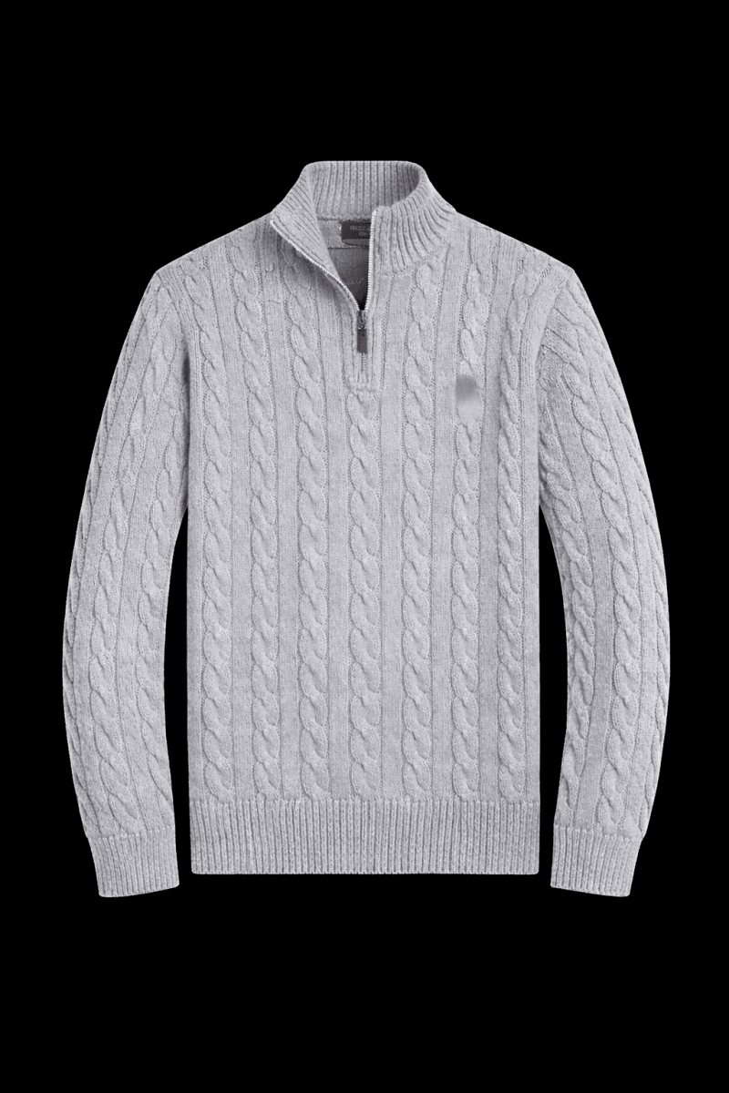Close-up of a horse knit quarter zip sweater by Theplugcrew, showing the textured fabric and quarter-length zipper detail.