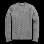 Close-up of a cozy horse-knit sweater by Theplugcrew, featuring detailed knitted patterns and warm, earthy tones.