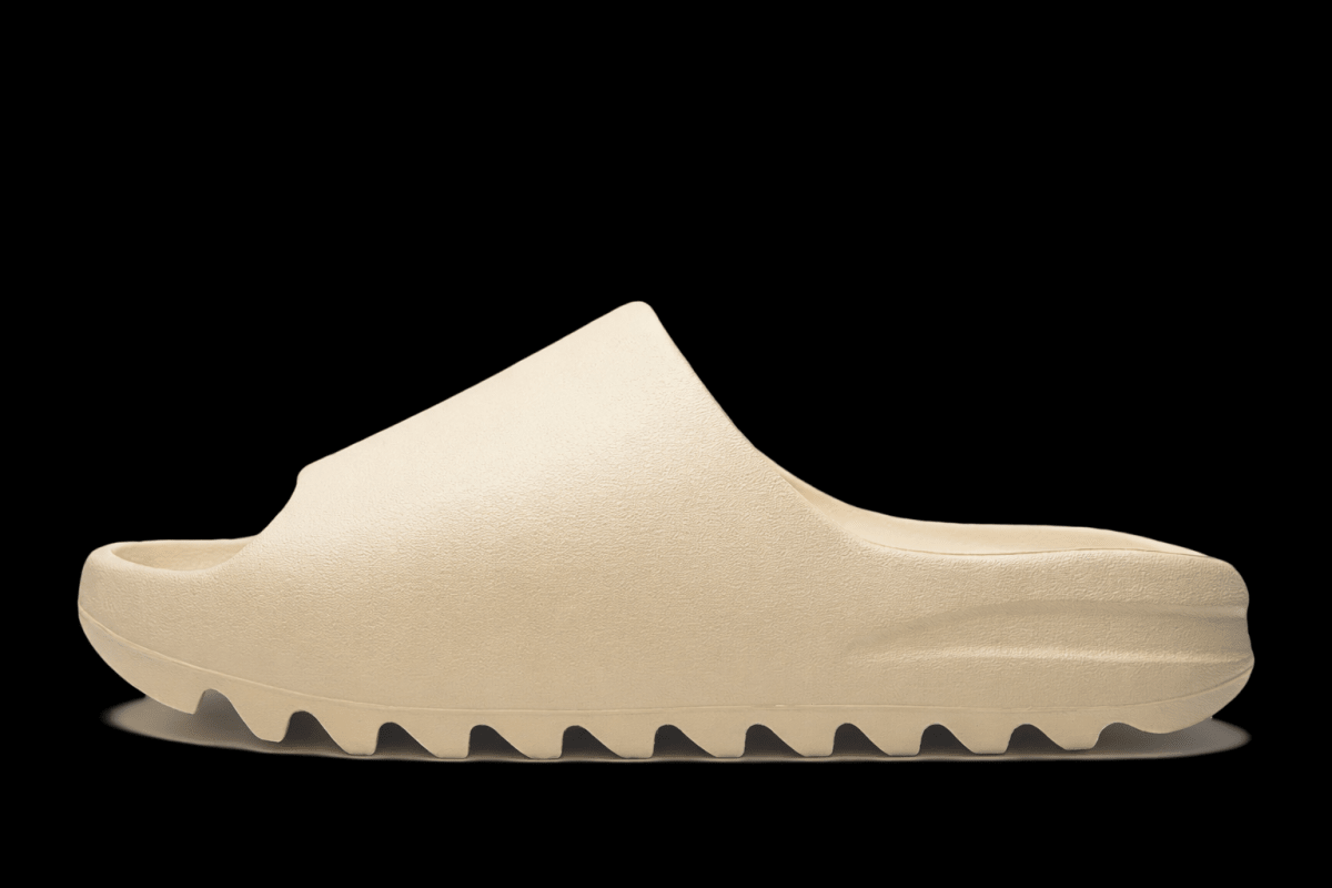 Reselling Vendor Zeezy slides in black, featuring wide straps and comfortable sole, suitable for casual wear and lounging.